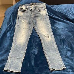 Express size 4 Long light blue distressed jeans.